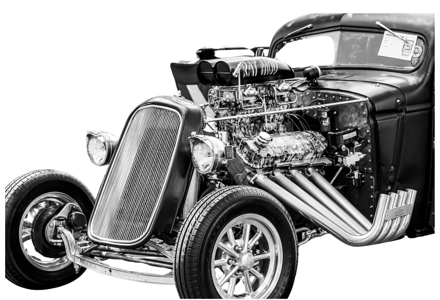 Black-and-white hot rod with an exposed engine