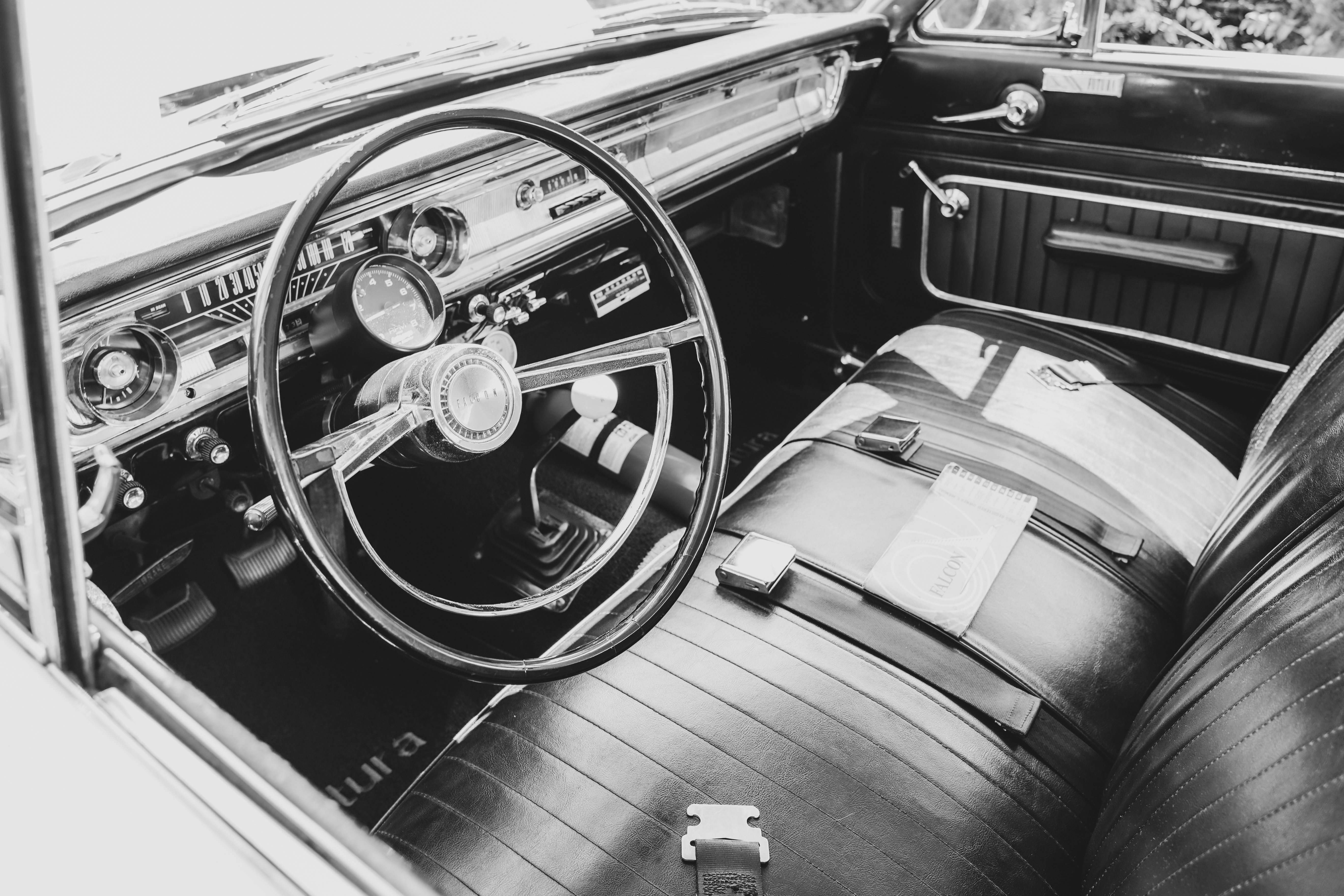 Black-and-white view of a classic car interior